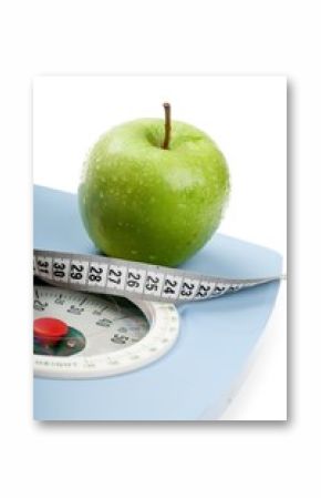 A Green Apple and a Measuring Tape on a Weight Scale