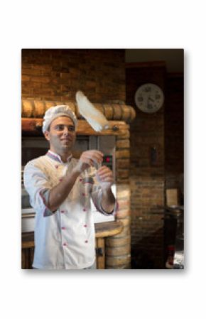 Skilled chef preparing dough for pizza rolling with hands and throwing up