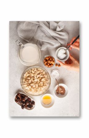 Ingredients for raw vegan cake, cashew cake on a white background.
