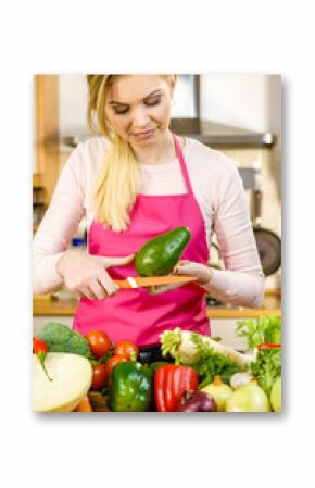 Woman cutting avocado