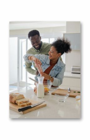 Preparing breakfast, African American couple smiling together in kitchen, enjoying time