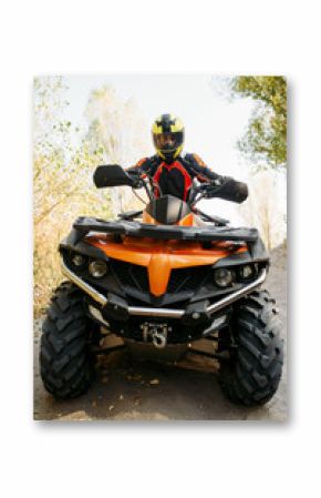 Rider in helmet on quad bike, front view, closeup