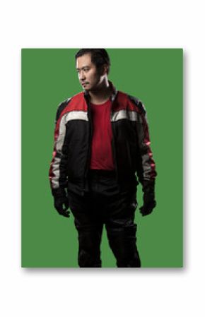 Male wearing protective leather and textile suit for racing race cars or motorcycles.  The armor is worn in professional motor sports.  The man is on a green screen or chroma key background.