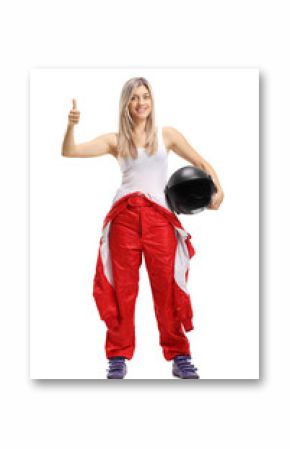 Female race driver holding her thumb up