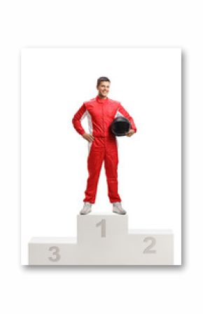 Male racer winner on a winner's pedestal holding a helmet