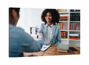 Law, consultation, agreement, contract, lawyer or attorney shakes hands to agree on the client's offer to be hired to fight the parties in court.