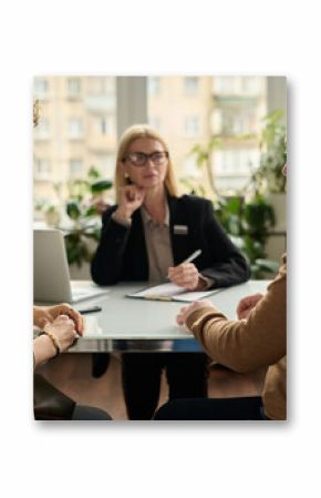 Back view portrait of adult couple consulting attorney in office settling legal matters in marriage