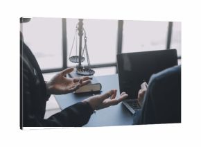 Business and lawyers discussing contract papers with brass scale on desk in office. Law, legal services, advice, justice and law concept picture with film grain effect
