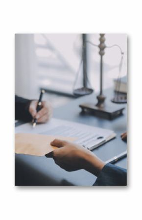 Business and lawyers discussing contract papers with brass scale on desk in office. Law, legal services, advice, justice and law concept picture with film grain effect