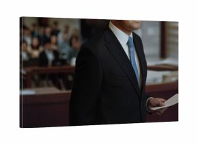 Lawyer hold paper evidence talking in a courtroom to speaking to jury or attorney in court