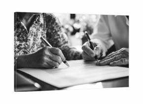 Happy Senior Couple Signing Legal Documents with Consultant