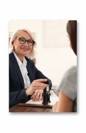 Female notary working with client in office