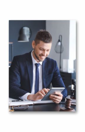 Male lawyer sitting at workplace in office