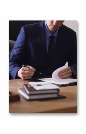 Male lawyer working at table in office, closeup