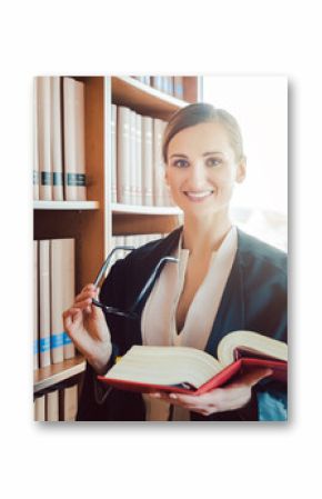 Lawyer working on a difficult case reading in the library