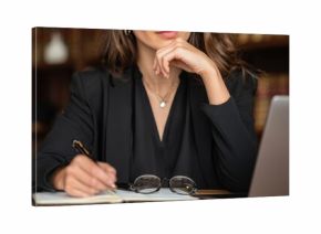 Business woman, laptop on desk, thinking and working in office for legal research, case prep or court review. Attorney and advocate for drafting will or legislation