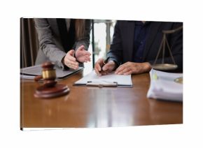 Two Lawyer with Document Paper and Hammer on Wood table,  Judge's Gavel, Law, Justice Symbol, Agreement and Partnership Concept,