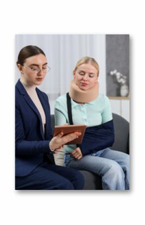 Injured woman having meeting with lawyer in office
