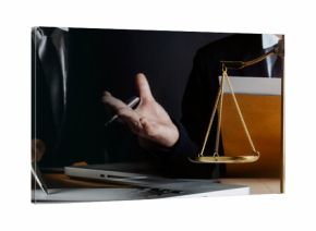 Business and lawyers discussing contract papers with brass scale on desk in office. Law, legal services, advice, justice and law concept picture with film grain effect