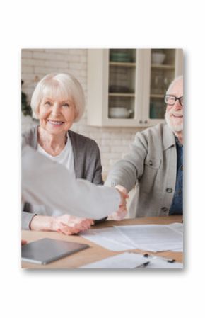 Happy old elderly senior grandparents family couple clients signs financial insurance, pension, startup, dealing handshake agent lawyer, agreement with customers on investment contract, bank manager