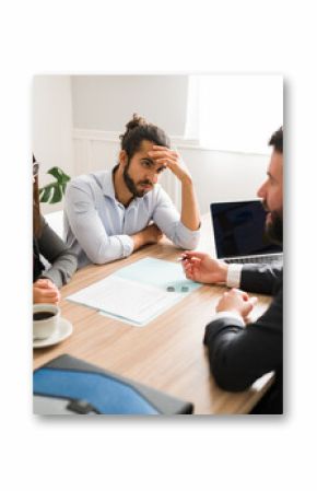 Divorce attorney talking to an angry couple