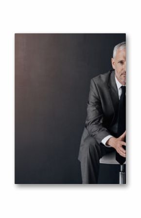 Mock up, chair and serious portrait of lawyer, attorney or businessman with confidence on dark background in studio space. Boss, ceo or business owner, proud senior executive director at law firm.