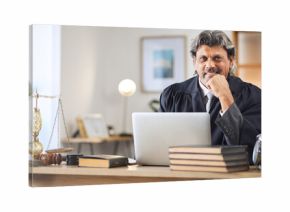 Justice, man and portrait in office with laptop for working in law firm, court research or search online for legal policy or rules. Judge, attorney or mature businessman in communication on computer