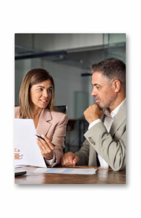 Female lawyer attorney or bank manager consulting male client holding papers during legal advice. Two business executives discussing financial accounting documents report working at meeting in office.