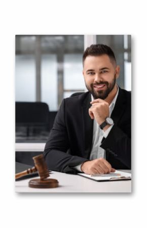 Portrait of smiling lawyer at table in office