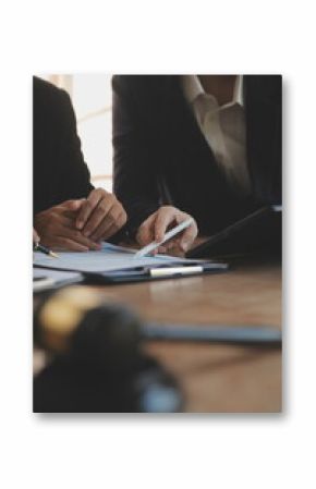 Lawyer, legal advisor, businessman brainstorming information on agreement details Business contracts in legal processing books for accuracy in contract documents. joint financial investment.