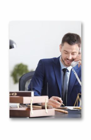 Young male notary working in office