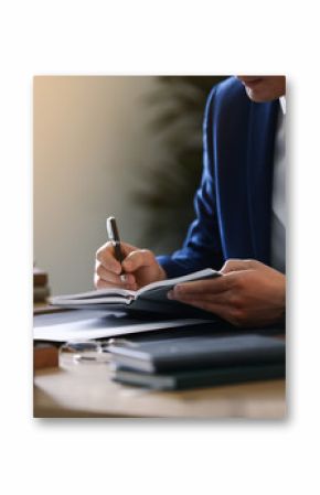 Male lawyer working at table in office, closeup