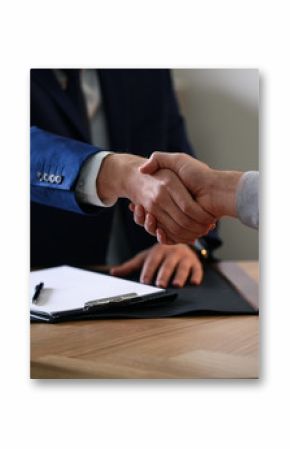 Male lawyer working with clients in office, closeup