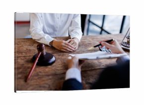 Two lawyers Consultation and conference discussing legal matters at a desk with a gavel, scales of justice law symbolizing law and justice, justice and lawyer Business partnership meeting concept.  