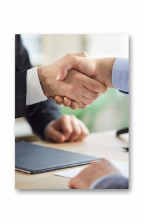 Lawyer or attorney shakes hand with client during office meeting, focusing on collaboration and deal in a professional setting with a sense of partnership and legal agreement and contract signing.