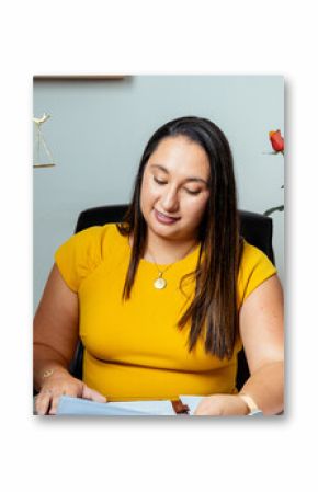 Focused professional woman reviewing documents in office