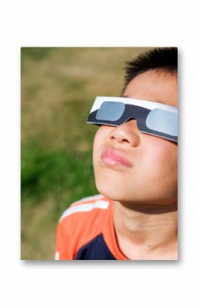 Asian Kid Looking at Solar Eclipse Using a Solar Lens Glasses