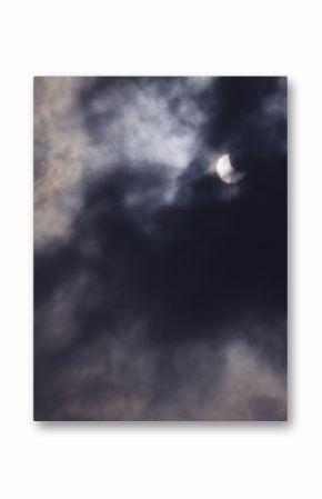 view on partial solar eclipse behind clouds