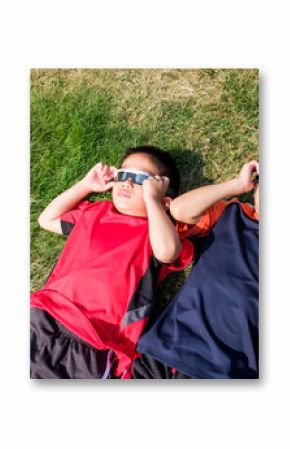 Asian Kids Looking at Solar Eclipse Using a Solar Lens Glasses