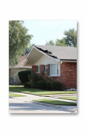 Suburban house with a collapsed roof. Destruction of residential property, insurance claim necessity. 