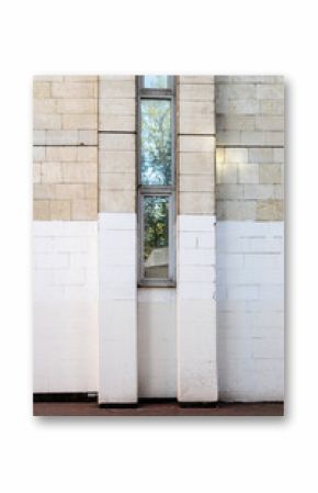 wall painted white from below with narrow window