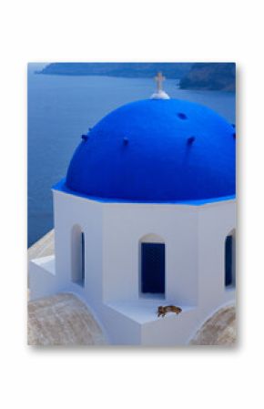 view of volcano caldera and sea with blue church dome close up, Oia, Santorini