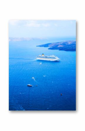 Thira and caldera of Santorini volcano with ships, Greece