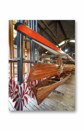 sport rowing oars and kayak on a wall