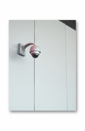 Security camera mounted on a white wall indoors