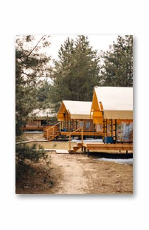 Glamping from tent houses in the forest.