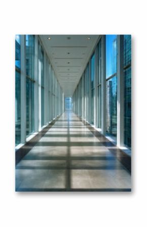 A modern hallway bathed in natural light, showcasing sleek glass walls and polished flooring, providing a serene passageway perfect for urban exploration or office environments.