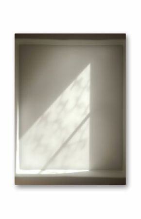 Abstract shadow play: Geometric light patterns on a textured wall background