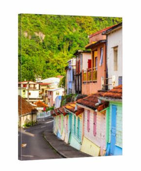 Colorful houses in Grande Riviere, Martinique, France, along General Charles de Gaulle Avenue. Grand Riviere the northernmost town of the Caribbean island of Martinique.