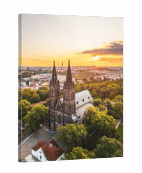 Vysehrad Basilica of St. Peter and St. Paul stands tall against a stunning sunrise in Prague.